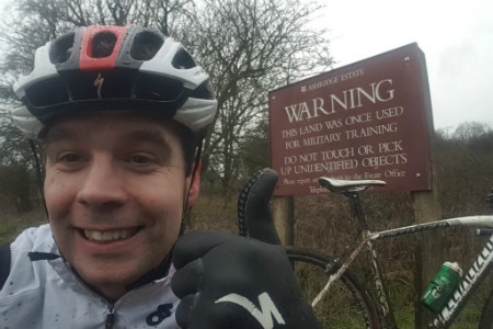 dave in front of a warning sign